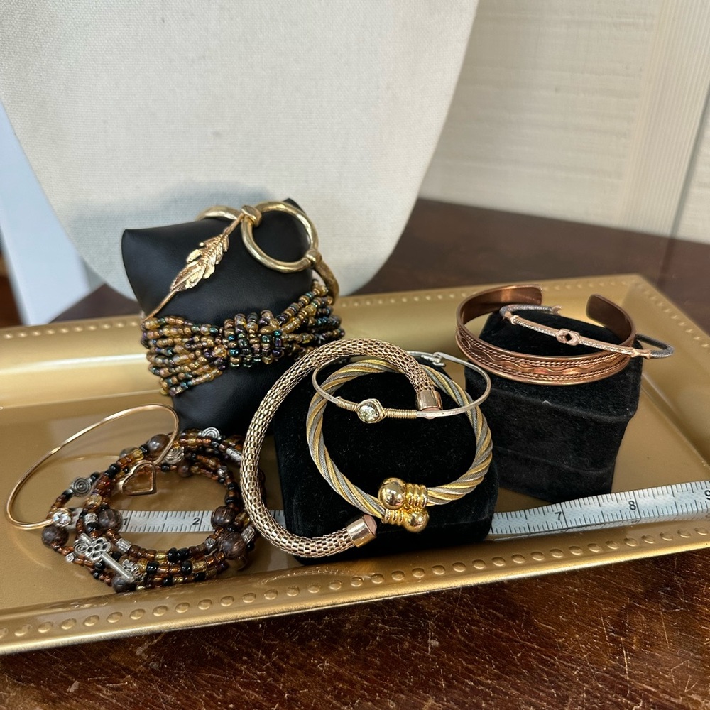 Large group of 10 goldtone and beaded bracelets